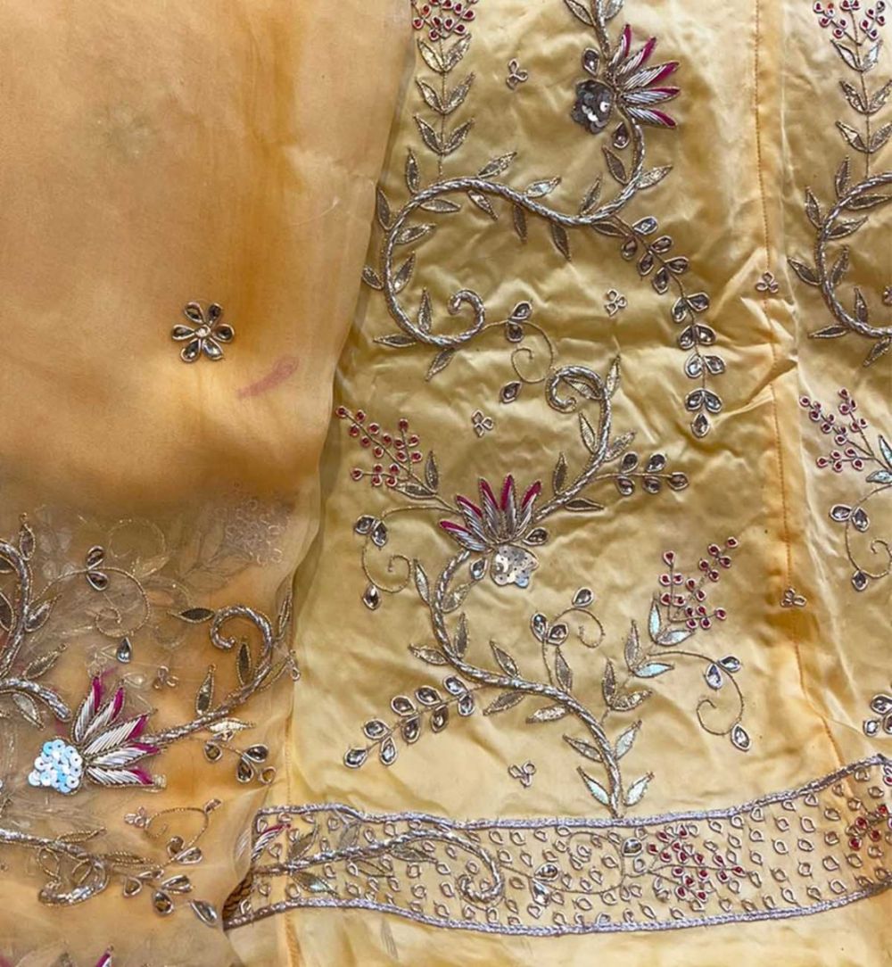 Cream Poshak with heavy Jardoji Work at Beendani