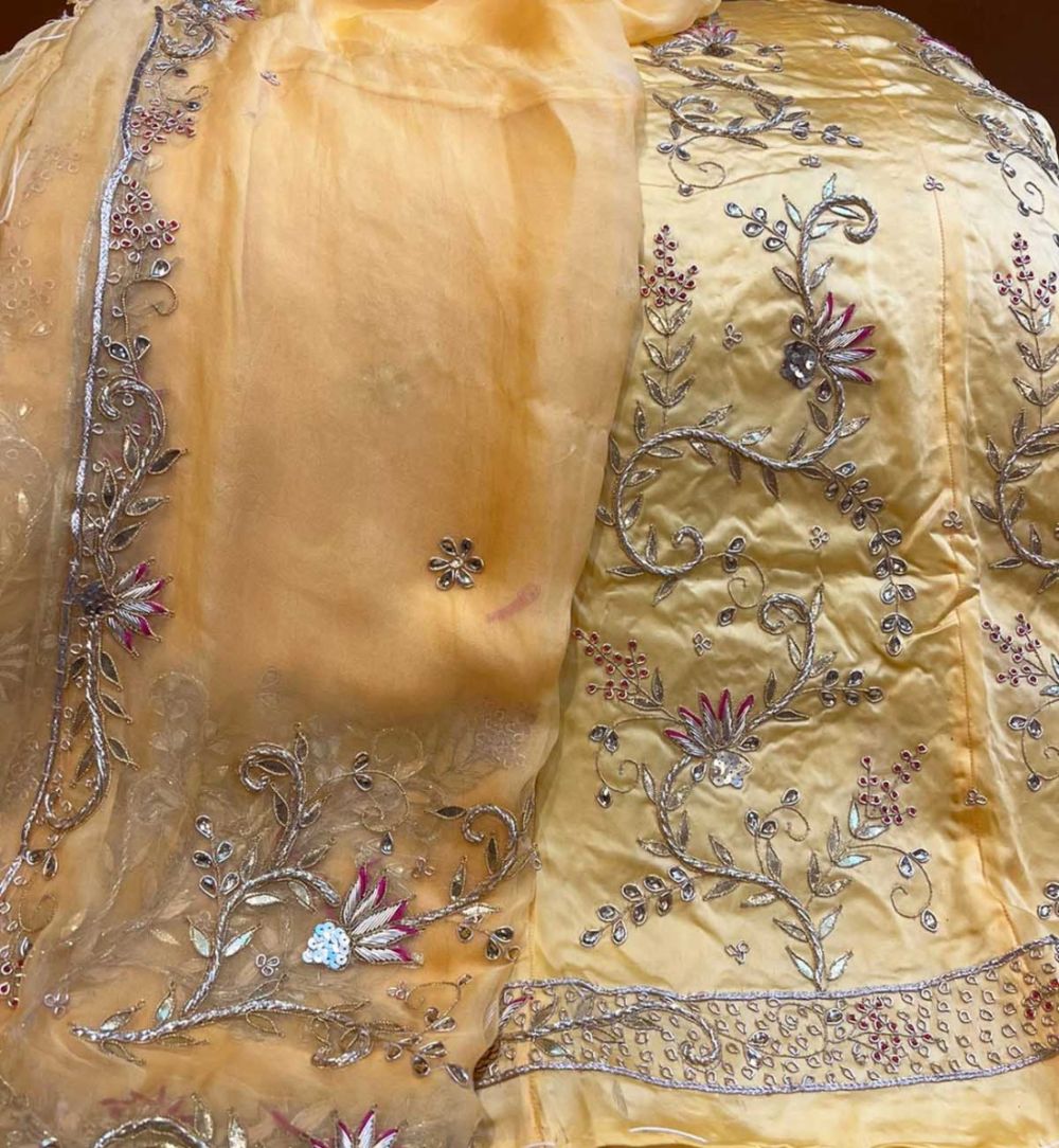 Cream Poshak with heavy Jardoji Work at Beendani